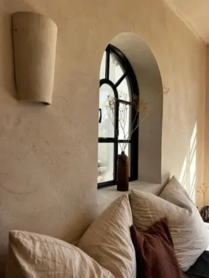a living room with a couch and a window at Luxury Beach Front Boutique Hideaway with Pool - Casita Mas Tranquila in Conil de la Frontera