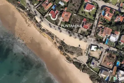an aerial view of a beach with houses at Luxury Beach Front Boutique Hideaway with Pool - Casita Mas Tranquila in Conil de la Frontera