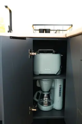 a kitchen with a sink and a coffee maker at El Olivar de Baro in Jerez de la Frontera