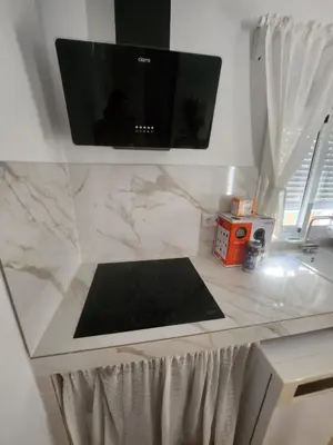 a kitchen counter with a television on top of it at Casa Las Piletas in Sanlúcar de Barrameda