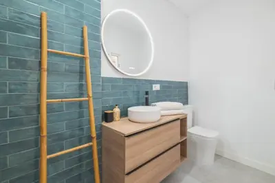 a bathroom with a sink and a mirror at Cadizz- Andalusian Green Palace - ideal familias centro del Puerto Santa María in El Puerto de Santa María