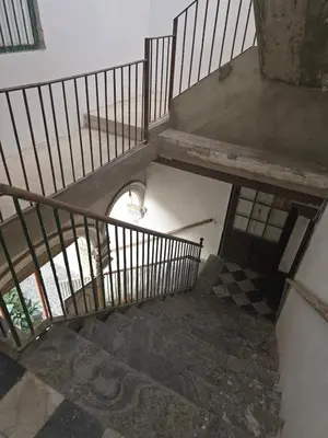 an overhead view of a winding staircase with twoadders at Cadizz- Andalusian Green Palace - ideal familias centro del Puerto Santa María in El Puerto de Santa María
