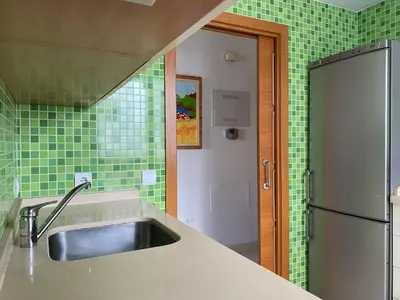 a kitchen with a sink and a refrigerator at Apartment with terrace Jerez Norte Hipercor in Jerez de la Frontera