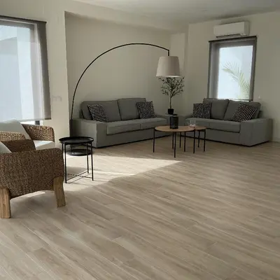 a living room with two couches and a table at Esmeralda Sea Villa - Beach&Golf Sancti Petri in Novo Sancti Petri