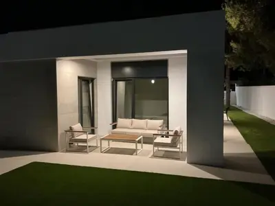 a living room with a couch and two chairs at Esmeralda Sea Villa - Beach&Golf Sancti Petri in Novo Sancti Petri