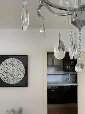 a kitchen with a chandelier hanging from the ceiling at Lazzy House in Hozanejos