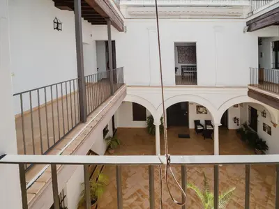an overhead view of a large building with a staircase at Sibs Sanlucar Fariñas 11-15 - Historical building in Sanlúcar de Barrameda