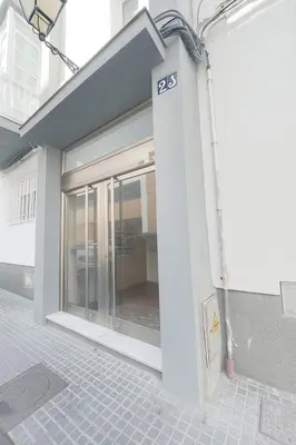 a building with a sliding glass door with the number at El Viñero, Apartamento con garaje in Cádiz