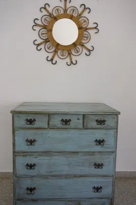 a dresser with a mirror on top of it at Magnifico alojamiento a 14 metros de la playa con magnificas vistas in Chipiona