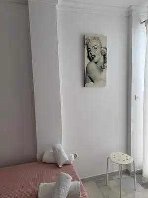 a room with a picture of a man on the wall at Apartamento Los Pajaritos II in Jerez de la Frontera