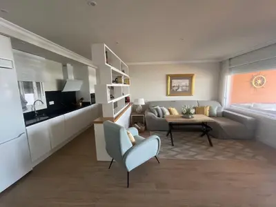 a living room with a couch and a table at Mirador de Sanlucar 2 in Sanlúcar de Barrameda