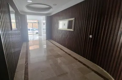 a hallway with wooden walls and a painting on the wall at Ático con espléndida terraza in Cádiz