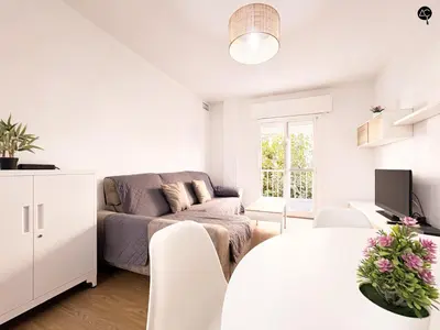 a white living room with a couch and a tv at Apartamento La Caleta Grupo AC Gestion in Cádiz