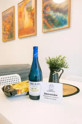 a bottle of wine sitting on top of a table at Casita ENTREARCOS in Arcos de la Frontera