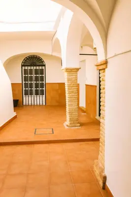 an empty room with a door and a tile floor at Casita ENTREARCOS in Arcos de la Frontera