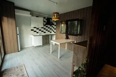 a kitchen with a table in the middle of it at Casita Verbena Retreat in Novo Sancti Petri