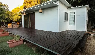 a wooden deck in front of a house at Casita Verbena Retreat in Novo Sancti Petri