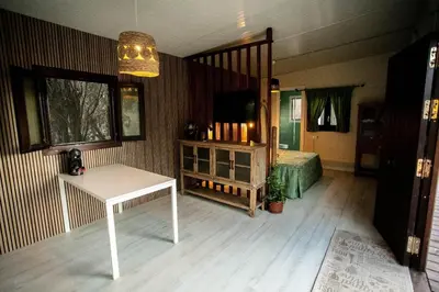 a room with a bed and a table in a room at Casita Verbena Retreat in Novo Sancti Petri