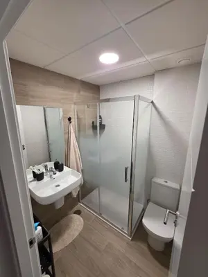 a bathroom with a shower and a sink and a toilet at GINVA - Costa Ballena & Jardines de Majadales in Chipiona