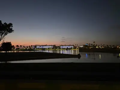 a view of a city at night with a body of water at GINVA - Costa Ballena & Jardines de Majadales in Chipiona