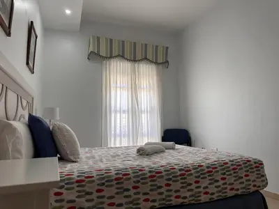 a bedroom with a bed and a window at La Torre de los Claustros - Ole Solutions in Jerez de la Frontera