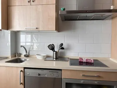 a kitchen with a sink and a stove top oven at La Torre de los Claustros - Ole Solutions in Jerez de la Frontera