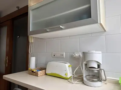 a kitchen counter with a toaster and a coffee maker at La Torre de los Claustros - Ole Solutions in Jerez de la Frontera
