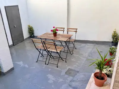 a wall with flowers in pots on it at Apartamento Molino de Algarrobo in Arcos de la Frontera