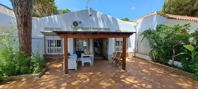 a patio with a pavilion in front of a house at Doña Violeta - La Barrosa in Novo Sancti Petri