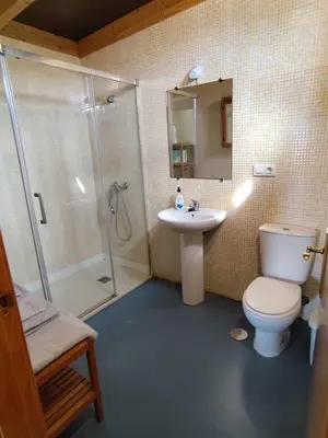a bathroom with a toilet and a shower and a sink at Brisa&Mar in Chiclana de la Frontera