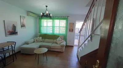 a living room with a couch and a table at Costa Playasol in Novo Sancti Petri