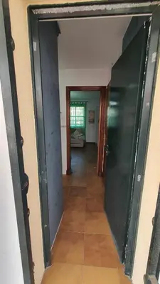 a hallway with a door leading into a room at Costa Playasol in Novo Sancti Petri
