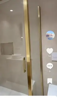 a glass door of a bathroom with a toilet at Casa Isabel in Chipiona