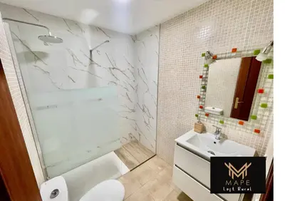 a white bathroom with a sink and a mirror at Mape Loft Rural El MIMBRAL in Algar