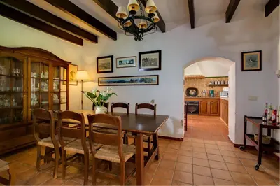 a kitchen and dining room with a table and chairs at El Molino del Pilón by Vintage Travel in Arcos de la Frontera