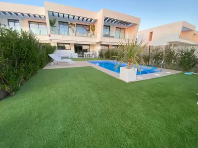 a house with a yard with a swimming pool at Cadiz Golf & Homework in Puerto Real