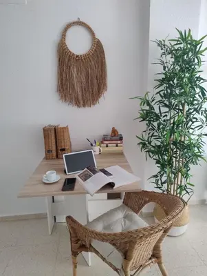 an office with a desk with a laptop and a plant at Piso a estrenar en el pintoresco Barrio Alto in Sanlúcar de Barrameda