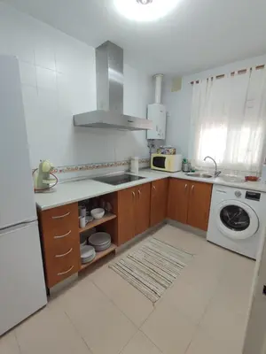 a kitchen with a sink and a stove top oven at Piso a estrenar en el pintoresco Barrio Alto in Sanlúcar de Barrameda