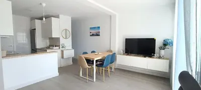 a kitchen and dining room with a table and chairs at Villa Brinco in Chipiona