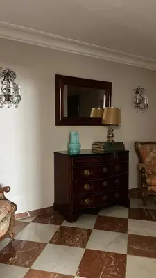 a living room with a dresser and a mirror at Apartamento centrico, 5 bedrooms, 5 baños en-suite in Jerez de la Frontera