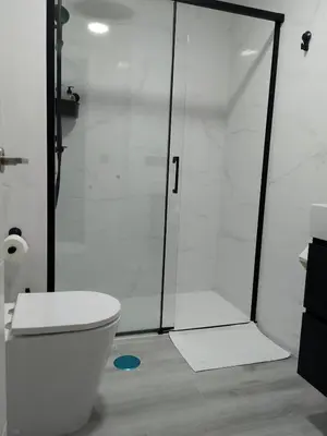 a bathroom with a shower and a toilet at Light and spacious apartment in the heart of San Fernando, Cádiz in San Fernando