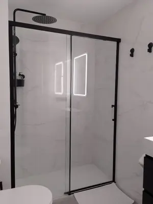 a shower with a glass door in a bathroom at Light and spacious apartment in the heart of San Fernando, Cádiz in San Fernando
