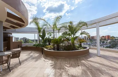 a balcony with palm trees on a building at Holiday Homes - Sky Garden Jerez in Jerez de la Frontera