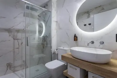 a bathroom with a sink and a shower and a toilet at Holiday Homes - Sky Garden Jerez in Jerez de la Frontera