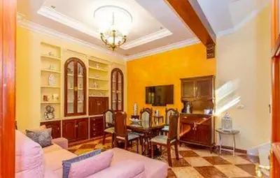 a living room with a couch and a table at Villa Stella maison entre Séville et Cadix in Lebrija