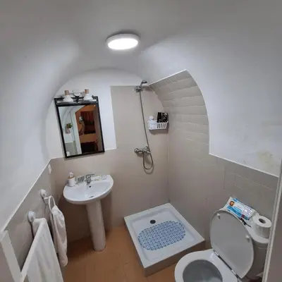 a small bathroom with a sink and a toilet at Habitación con baño privado in Sanlúcar de Barrameda