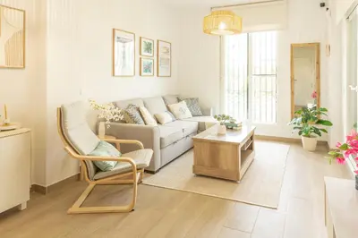 a living room with a couch and a table at Blue Moon House Costa Ballena by Sanlúcar Housing in Costa Ballena