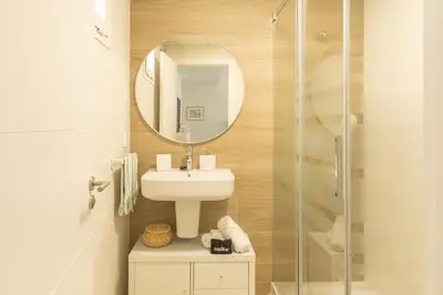 a bathroom with a sink and a mirror at Blue Moon House Costa Ballena by Sanlúcar Housing in Costa Ballena