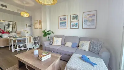 a living room with a couch and a table at Blue Moon House Costa Ballena by Sanlúcar Housing in Costa Ballena
