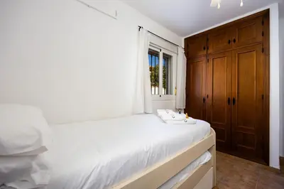 a bathroom with a tub and a toilet and a sink at Atlantic Sun Villa - Chiclana in Chiclana de la Frontera